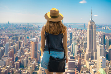 Travel tourist woman enjoying view of Manhattan skyline in New York city. Happy lifestyle girl with...