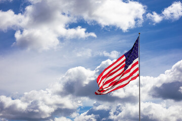 American Flag with Clouds and Blue Sky