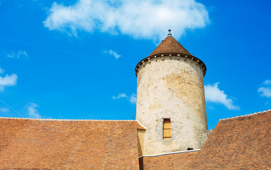 Fototapeta na wymiar Walls roof old tower of Blandy-les-Tours castle over sky
