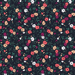 Beautiful floral pattern in small abstract flowers. Small colorful flowers. Light black background. Ditsy print. Floral seamless background. The elegant the template for fashion prints. Stock pattern