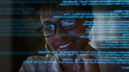 App Programmer Looking at Hologram of Program Code Machine Learning Data Algorithm.
Lateral Dolly Focused Young African American Software Developer or Engineer Programming Code Writing and Smiling. - Powered by Adobe