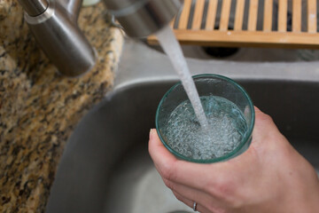 Filling up cup with water