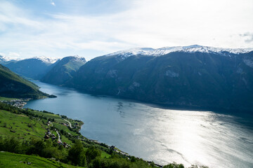Naklejka na ściany i meble Beautiful Naerofjord with high mountains and waterfall in Norway