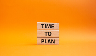 Time to plan symbol. Wooden blocks with words Time to plan. Beautiful orange background. Business and Time to plan concept. Copy space.