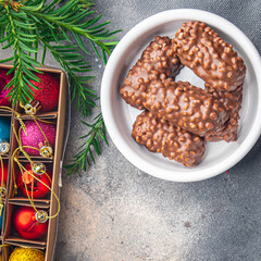 christmas chocolate chip cookies nuts, dried fruits New Year sweet dessert home holiday atmosphere meal food snack on the table copy space food background rustic top view