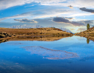 Autumn alpine Kleiner Paarsee or Paarseen lake, Land Salzburg, Austria. Alps Hochkonig rocky mountain group view in far.