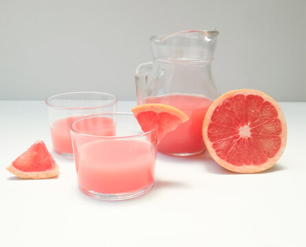 Refreshing Summer Grapefruit Drink, Pitcher And Glasses With Grapefruit Slices And Juice