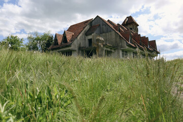 Fototapeta na wymiar Old abandoned house in village on sunny day