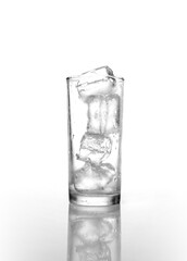 Ice in the glass isolated on white
