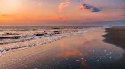 Fototapeta na wymiar colorful sunset on the beach, mud flat 