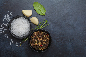 Food background from vegetable, spices, herb on black table.