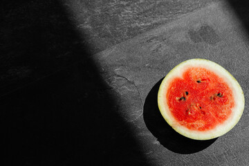 Fototapeta na wymiar sliced fresh watermelon isolated on dark background
