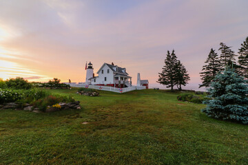 Pemaquid Point Lighthouse at sunrise during on a summer morning in Bristol, Maine