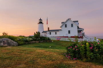 Fototapeta na wymiar Pemaquid Point Lighthouse at sunrise during on a summer morning in Bristol, Maine
