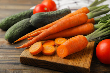 Fresh carrots on brown texture background. Ingredient for salad.Vegetarian organic vegetables.Healthy food.Copy space.Place for text