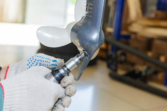 The master carries out maintenance of the boat motor.