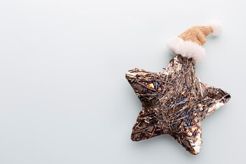 Christmas star, decor on pastel blue background.