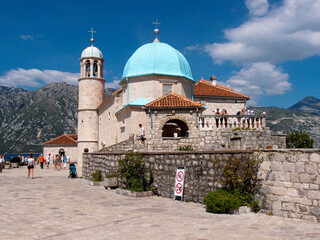 Fototapeta na wymiar Beautiful view of the artificial island Gospa od krpjela, Our Lady of the Rocks, Roman Catholic Church, Perast, Bay of Kotor, Montenegro