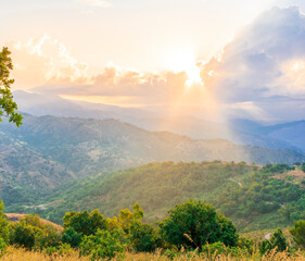 Fototapeta na wymiar Mountain valley during sunset or sunrise. Natural spring or summer season landscape