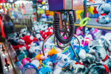 Fairground attraction catching stuffed toys 