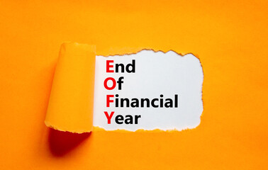 EOFY end of financial year symbol. Concept words EOFY end of financial year on white paper on beautiful orange background. Black calculator and pen. Business and EOFY end of financial year concept. - obrazy, fototapety, plakaty