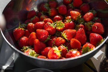 fresh red ripe strawberries in a bowl