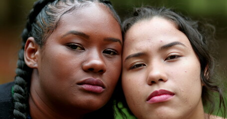 Beautiful ethnically diverse women posing to camera