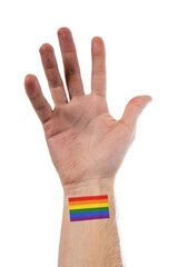 Beautiful and stylized open hand of caucasian person with a big tattoo of LGBTQ flag of pride over 100% white background