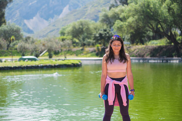 Obraz premium Young woman doing different sports activities, outdoors in a park.