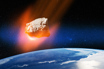 Planet Earth and big asteroid in the space. Potentially hazardous asteroids. Asteroid in outer...