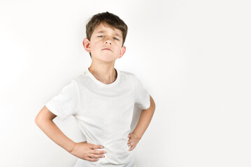 Portrait of a young boy with a defiant, slightly impudent look, he demands and asks something from...