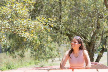 Young woman doing different sports activities, outdoors in a park.
