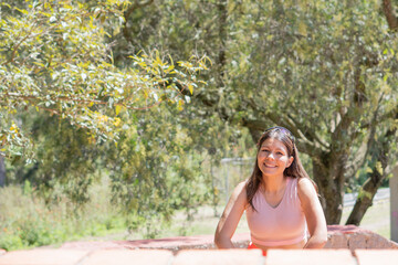 Naklejka premium Young woman doing different sports activities, outdoors in a park.