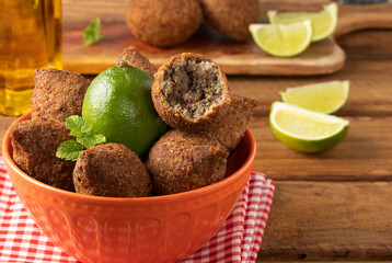 Typical Arabian snack known as kibbeh. Selective focus.