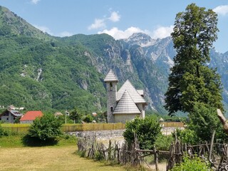 Fototapeta na wymiar village with church in the mountains in Albania