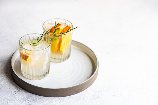 Close-Up Of Two Summer Cocktails With Fresh Fruit On A Tray