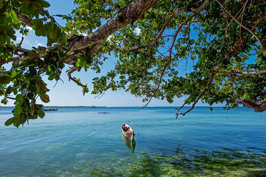 Small boat anchored on Debut beach, Kei Kecil, Kei islands, Maluku Province, Indonesia