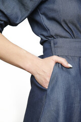 Serie of studio photos of young female model wearing puff sleeved cotton denim dress