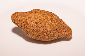 Syrian kibbeh isolated on white background in selective focus. Arabic kibe