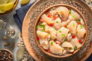 Arabic cuisine; Egyptian traditional boneless trotters soup. served with fresh lemon and black...