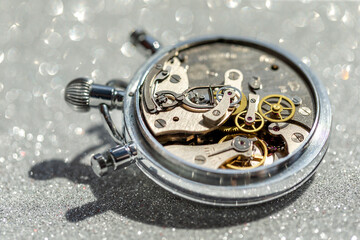 An old countdown timer opened up showing all the details of the mechanism, macro closeup