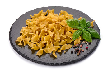Raw farfalle pasta, Itallian food, close-up, isolated on white background.