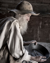 Old Gold Miner with Gold Pan