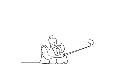 a mother and her child take a photo with a selfie stick smiling