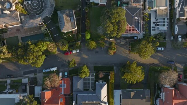 Aerial: Top down shot of beach front homes in Takapuna, Auckland, New Zealand