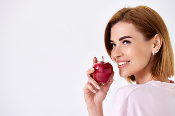 girl holding green apple isolated on white background