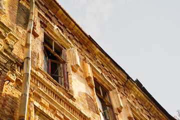 Fototapeta premium an old ruined building. broken glass in the windows.