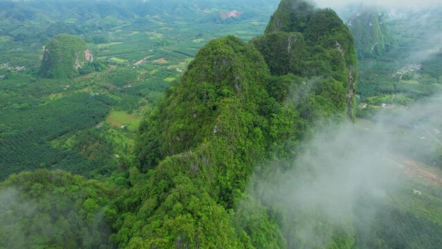 Drone are flying over beautiful clouds and mountains in the morning. Tropical scenery in Chumphon Province, Southern Thailand. 4k
