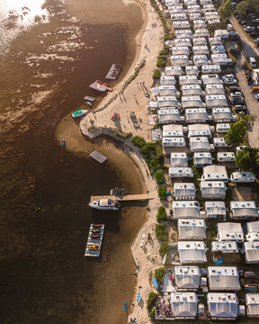 drone aerial view of the campsite, caravans and bay in Chałupy during sunset