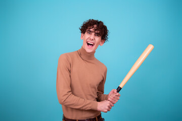 Young attractive guy with a bat. 